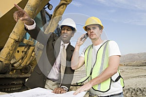 Engineer With Worker At Construction Site