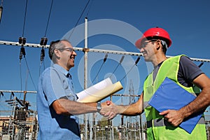 Engineer and Worker at Electrical Substation