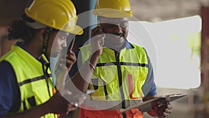 Engineer worker foreman Hispanic man using telephone calling communication in factory workplace