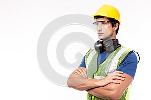 Engineer or worker in hardhat, safety vest, safety glasses in factory or site work. Engineer or professional contractor cross arm