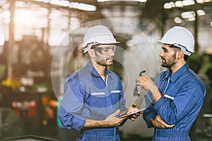 engineer worker male hispanic indian male teamwork happy working together in heavy metal industry steel lathe CNC factory