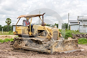 Engineer or Worker operator driving excavator on construction building site