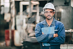 Engineer worker staff handle with user guide instruction manual text book in factory workplace