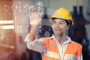 Engineer worker using advance technology digital hologram infographics touch panel in industry factory