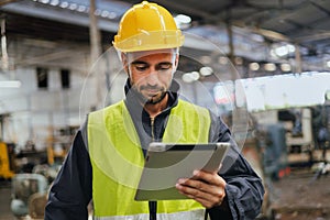 engineer worker using digital tablet for checking in factory