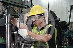 Engineer worker work with machine for quality of product in factory with confident