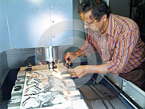 Engineer working on CNC machine