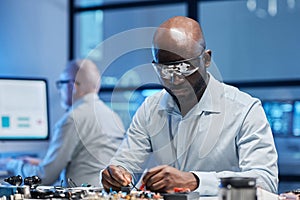 Engineer working with computer board