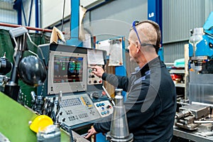 Engineer working with a numerical control machine