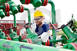 Engineer, working with pipeline controls inside oil and gas refinery