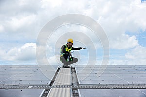 Engineer working setup Solar panel at the roof top. Engineer or worker work on solar panels or solar cells on the roof of business