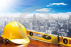 engineer working table and measure tape and level water tool equipment at high building construction site against blue sky with i