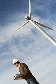 Engineer Working At Wind Farm