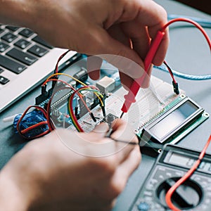 Engineer workplace testing electronic components