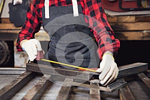 Engineer works with metal structures use with ruler