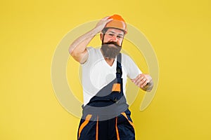 Engineered environment trend. Builder hard hat. Improvement and renovation. Brutal man builder. Bearded guy worker on