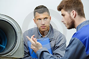 engineering apprentice talking to mentor