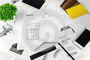Engineering and architecture drawings on workplace. Architect Desk with Engineering blueprint. Plan drawings