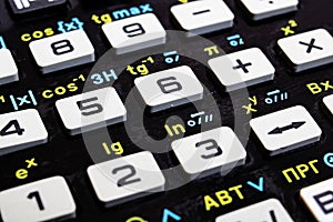 Engineering calculator buttons with formulas close up
