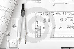Engineering compass is on building plan.