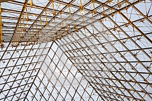 Engineering diagonal metal and cable tensioning structure supporting a glass pyramid with light