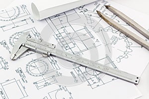 Engineering dividers Tools and Vernier scale on blueprint backgr