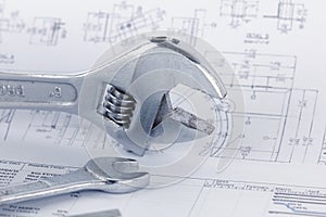 Engineering drawing documents with wrench. Maintencance concept