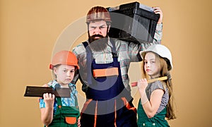 Engineering education. construction worker assistant. Father and daughter in workshop. Bearded man with little girls