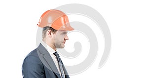 Engineering. Engineer side-face isolated on white. Serious engineer in hardhat. Profile portrait