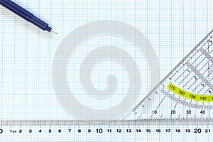 Engineering graph paper with ruler and pens