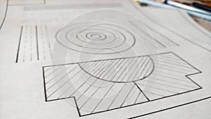 Engineering mechanical drawing on paper. Figures, lines, circle drawn by pencil. photo