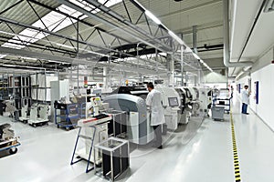 engineering in microelectronics: workers in the production and assembly of electronic high tech components in a modern factory photo