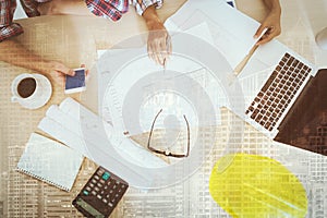 Engineering project accessories on desk in construction site or