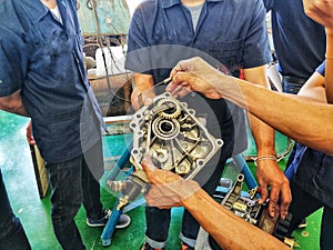 Engineering student Learning to disassemble the 4-cylinder diesel engine, Laboratory of engineering, Engine photo