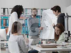 Engineering students discussing ideas together