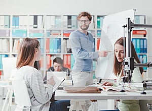 Engineering students discussing ideas together