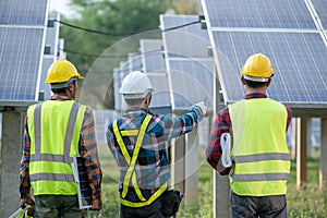 Engineering team inspecting and repairing solar cells on solar