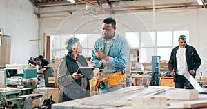 Engineering, teamwork and carpenter with tablet in a workshop manufacturing furniture. Woodwork planning, people or