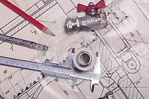 Engineering tools and plumbing details on a technical drawing. Design and production of communications.