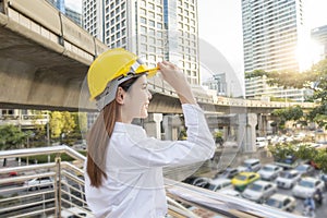 Engineering woman  is working in outdoor city background