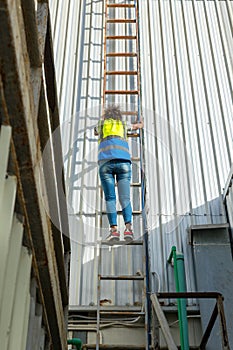 Engineering or worker descended the fire escape to the safe zone. Man in Fire escape to the roof. Worker climbing down fire escape