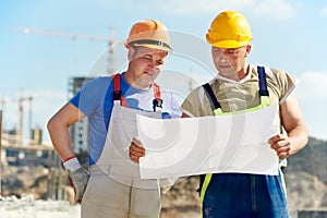 Engineers builders at construction site