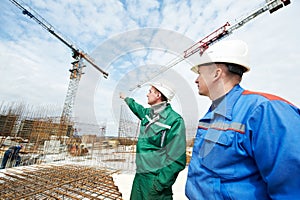 Engineers builders at construction site