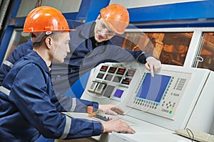 Engineers at control panel photo