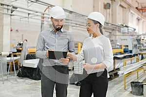 Engineers discussing production in window factory
