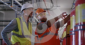 Engineers examining fire extinguishers on power plant