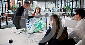 Engineers On GIS Team Using Design Software