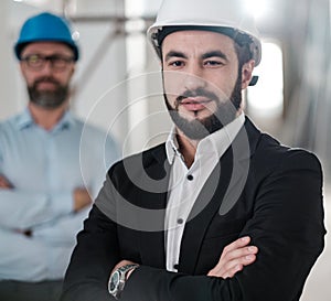 Engineers in hardhats have conversation