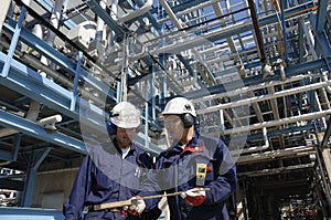 Engineers inside oil-refinery