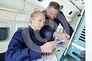 Engineers inside plane